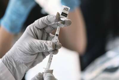 FILE Registered pharmacist Sapana Patel, loads a syringe with Monkeypox vaccine at a Pop-Up Monkeypox vaccination site on Wednesday, Aug. 3, 2022, in West Hollywood, Calif. Spain is struggling to curtail Europe's leading monkeypox outbreak since the disease spread beyond Africa. The southern European nation counts over 4,500 cases and two men have died from the disease. Authorities and groups in the LGBTQ community are honing their campaigns to get vaccines to the most needy members of the most affected demographic so far. (AP Photo/Richard Vogel, File)